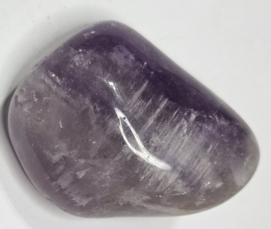 40.70 gram Amethyst Tumbled Stone: Item is the item in the image - Bidder is responsible for all value and grade determination - Please review all terms and conditions prior to placing any bids- All bids are an agreementtoallterms-