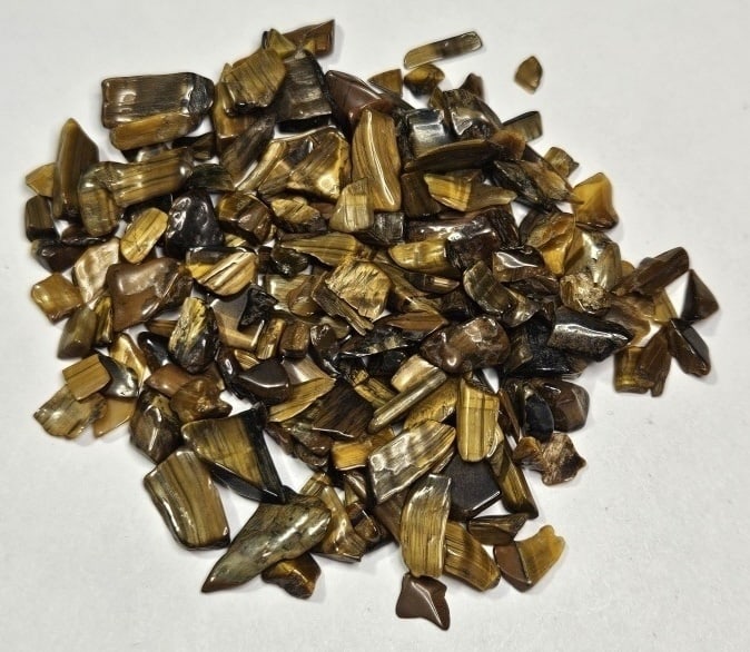 28.58 gram Natural Tiger Eye Chip Lot: Item is the item in the image - Bidder is responsible for all value and grade determination - Please review all terms and conditions prior to placing any bids- All 