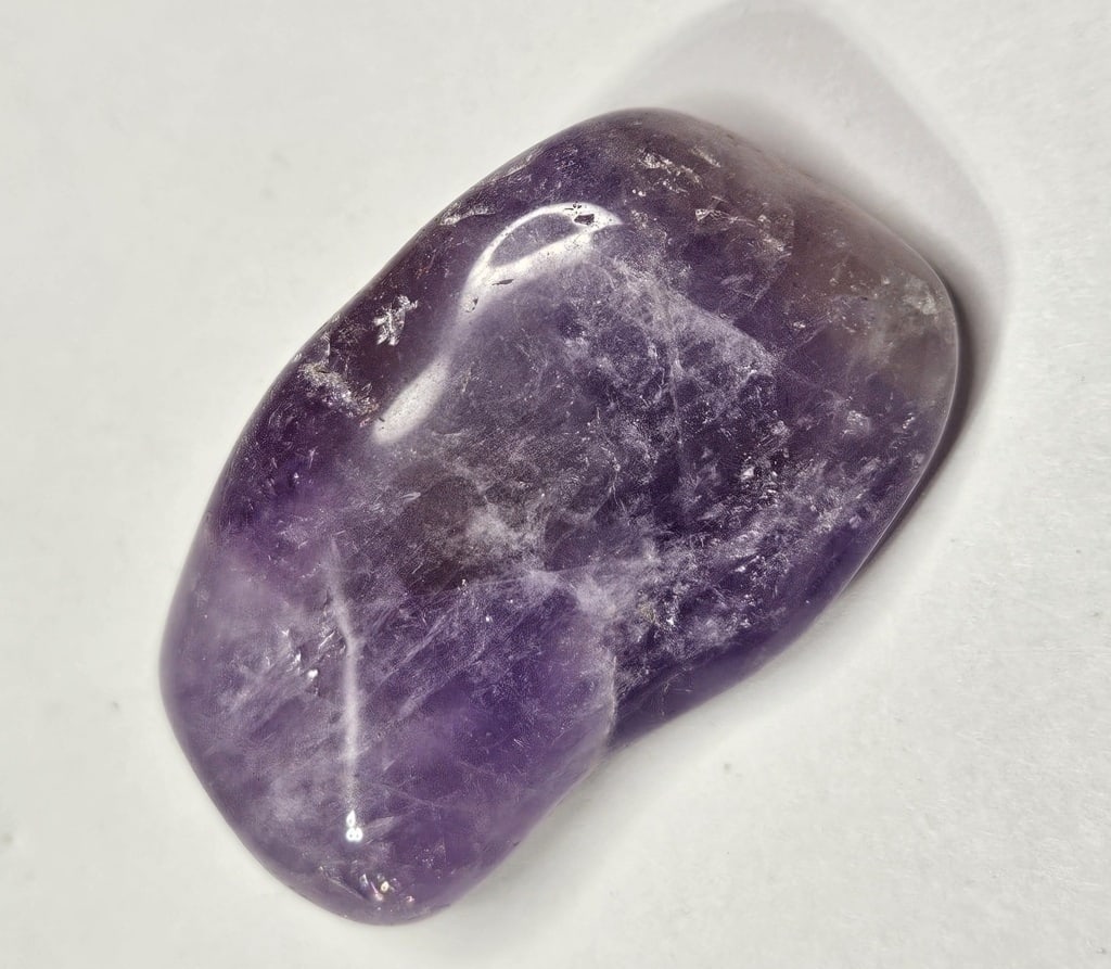 46.25 gram Large Tumbled Amethyst Stone: Item is the item in the image - Bidder is responsible for all value and grade determination - Please review all terms and conditions prior to placing any bids- All bids are an agreementtoallterms-