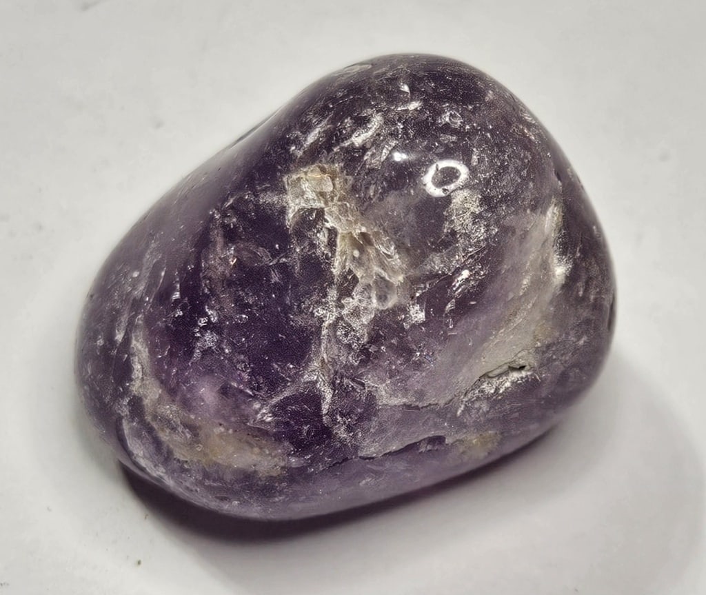 56.25 gram Natural Tumbled Amethyst Stone: Item is the item in the image - Bidder is responsible for all value and grade determination - Please review all terms and conditions prior to placing any bids- All bids are an agreementtoallterms-