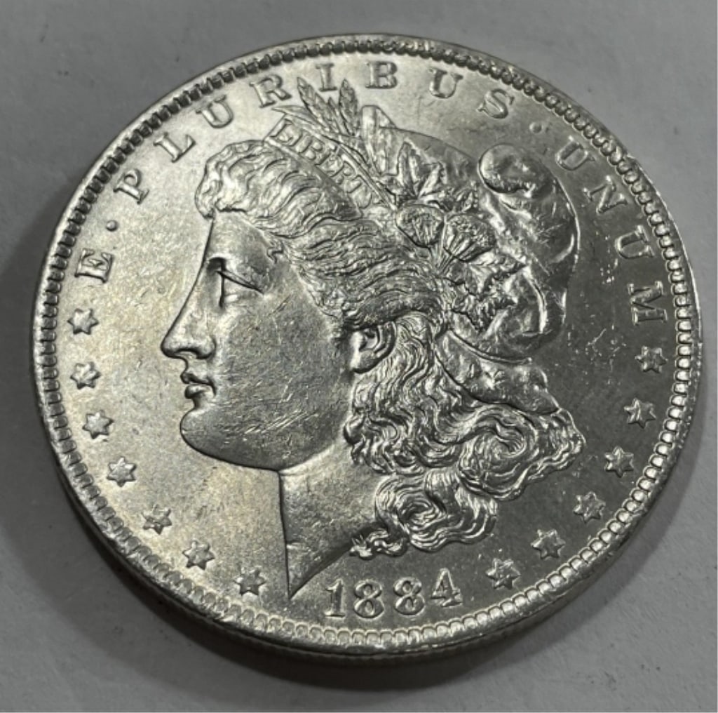 1884 o BU Grade Morgan Silver Dollar: Item is the item in the image. Bidder must determine grade and value by your bid amount. Please refer to all the terms set forth in this auction.