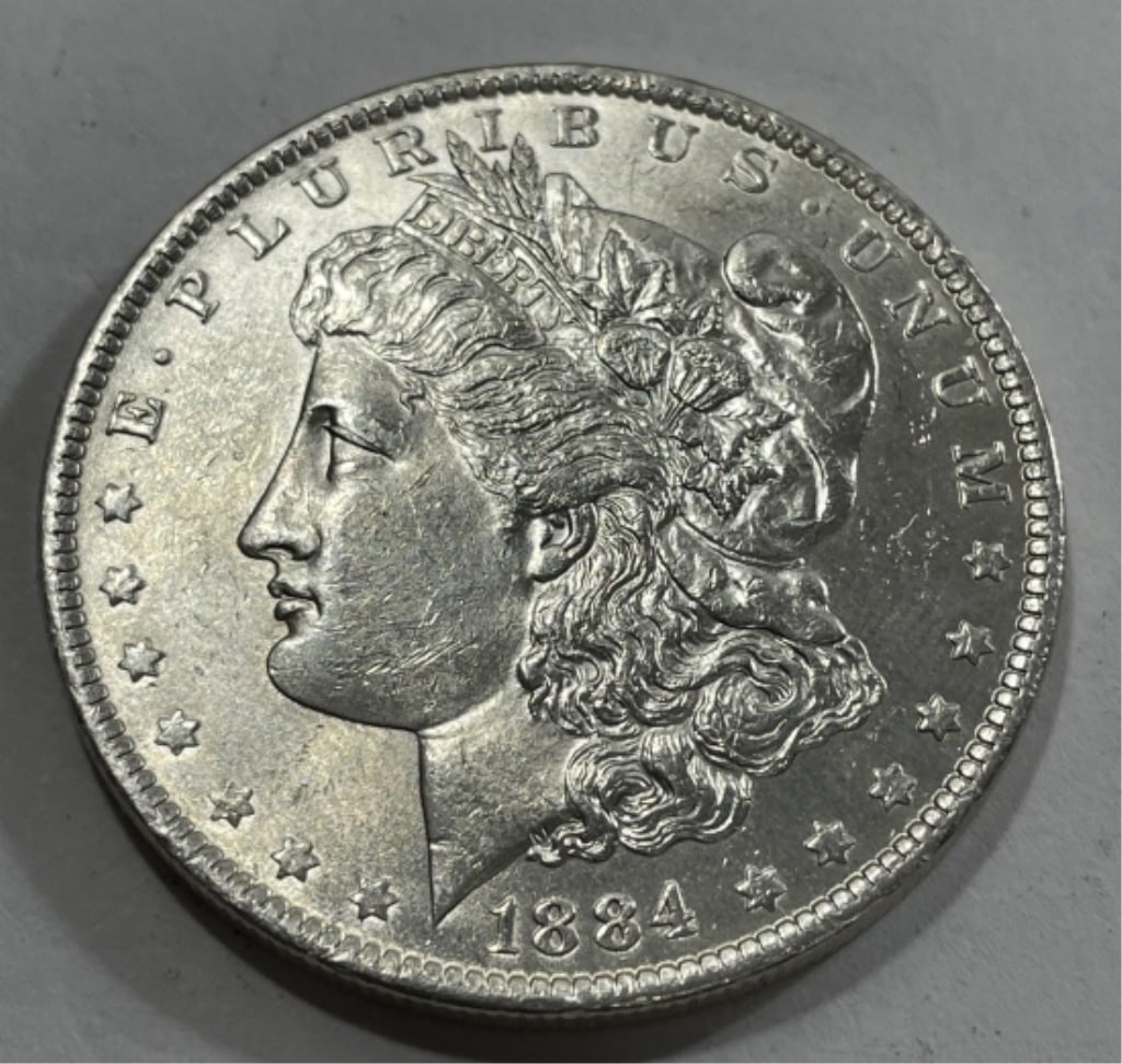 1884 o BU Grade Morgan Silver Dollar: Item is the item in the image. Bidder must determine grade and value by your bid amount. Please refer to all the terms set forth in this auction.