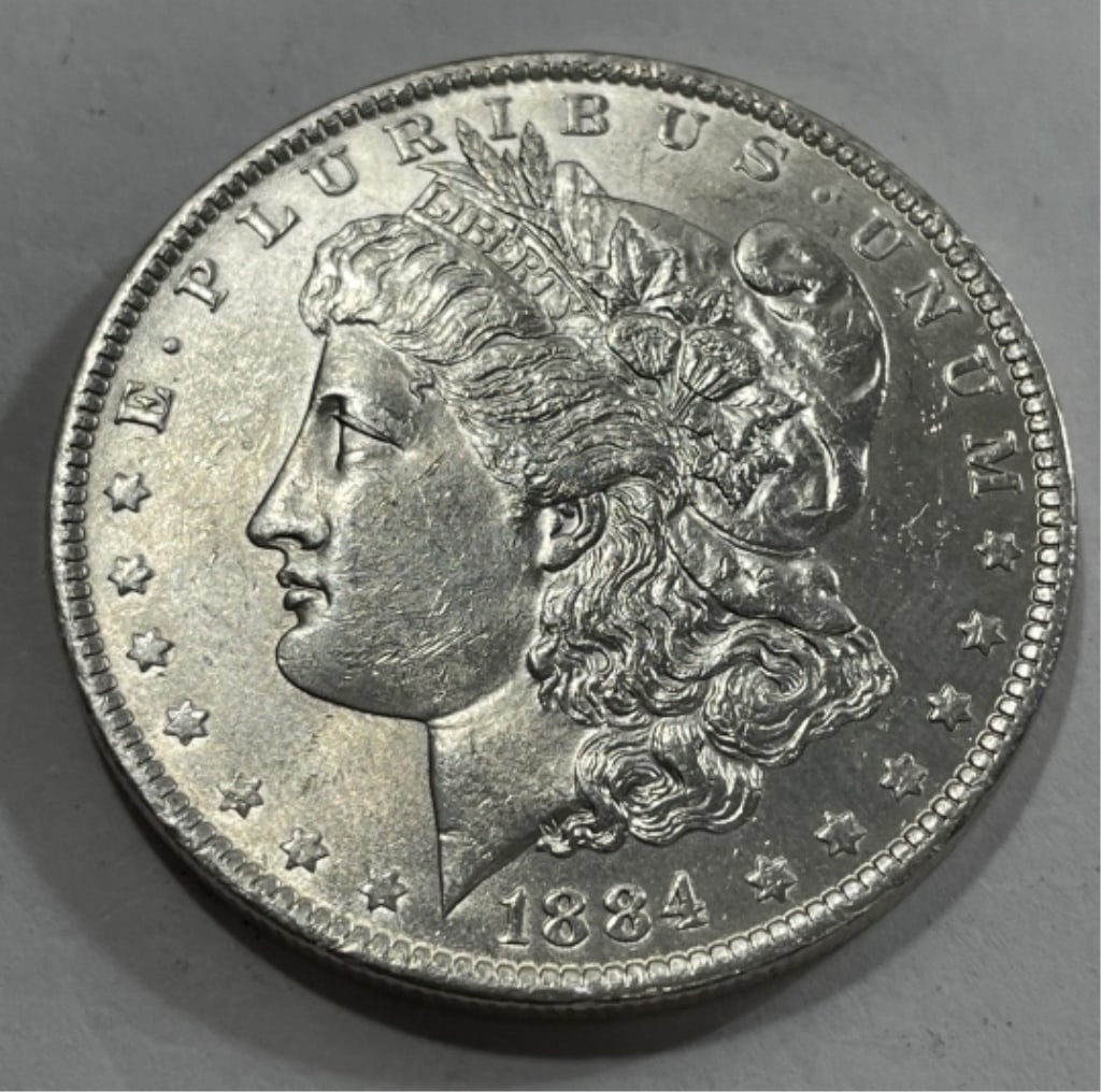 1884 o BU Grade Morgan Silver Dollar: Item is the item in the image. Bidder must determine grade and value by your bid amount. Please refer to all the terms set forth in this auction.
