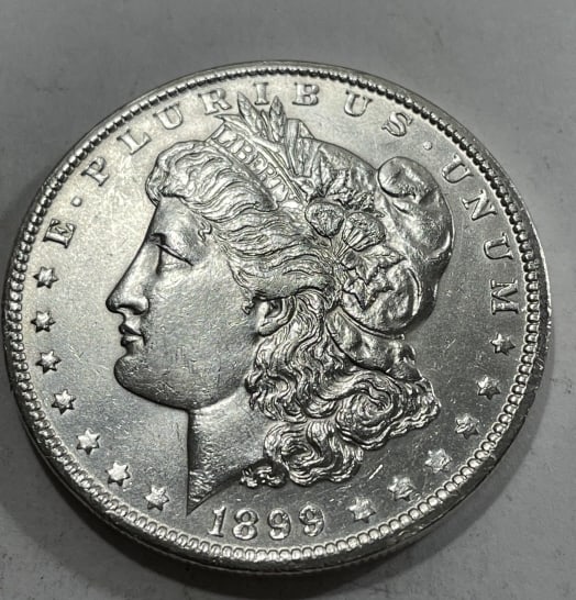 1899 o Better Date Morgan Silver Dollar BU Grade: Item is the item in the image. Bidder must determine grade and value by your bid amount. Please refer to all the terms set forth in this auction.