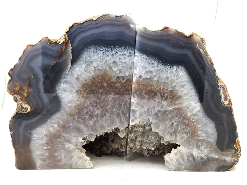 Stunning Banded Agate Bookends w/ Deep Geodes: Item is the exact item in the image - Please review all terms and conditions prior to placing any bids - Bidder is responsible for all value grade dtermination - All sales final and any bid is an agre