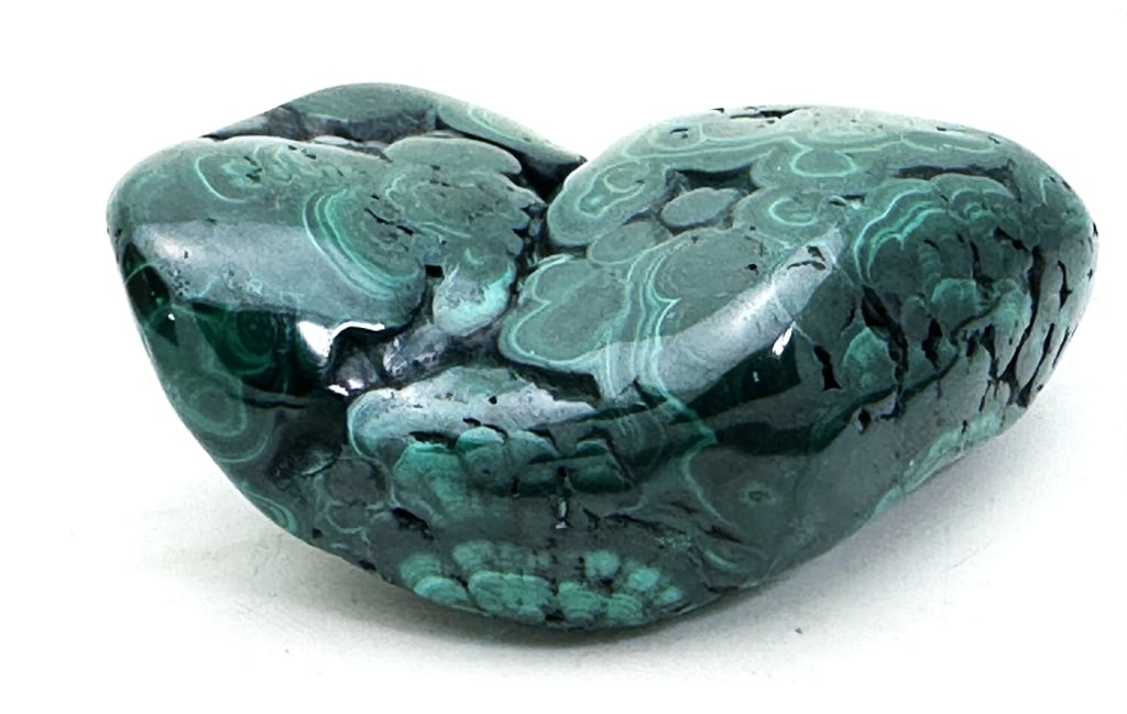 228.57 gram Natural Malachite Specimen: his opaque, green-banded mineral crystallizes in the monoclinic crystal system, and most often forms botryoidal, fibrous, or stalagmitic masses, in fractures and deep, underground spaces, where the wa