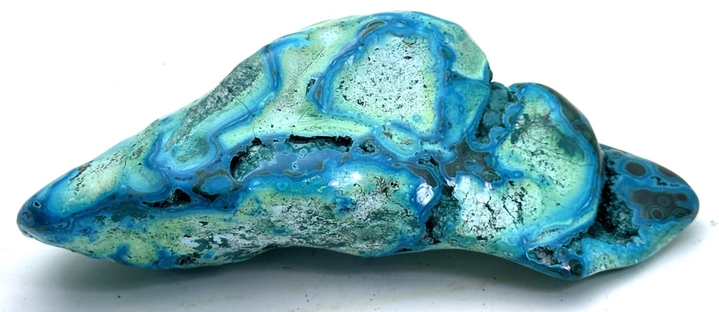 142.45 gram Natural Chrysocolla/Malachite Specimen: Chrysocolla has a cyan (blue-green) color and is a minor ore of copper, having a hardness of 2.5 to 7.0. It is of secondary origin and forms in the oxidation zones of copper ore bodies.