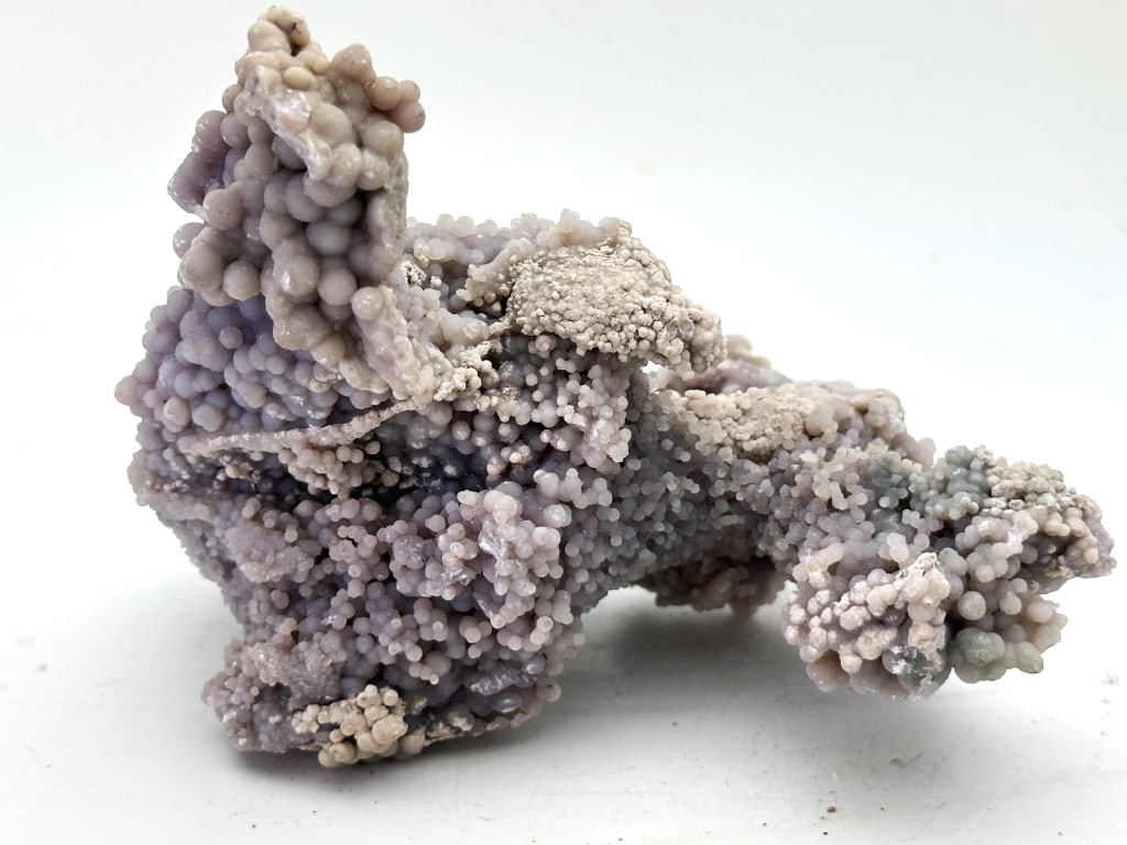 292.38 gram Freeform Grape Agate Specimen: Grape Agate is the name given to the botryoidal Purple Chalcedony that has been recently discovered in Indonesia. So far there has been only one locality found, making this an extremely rare and