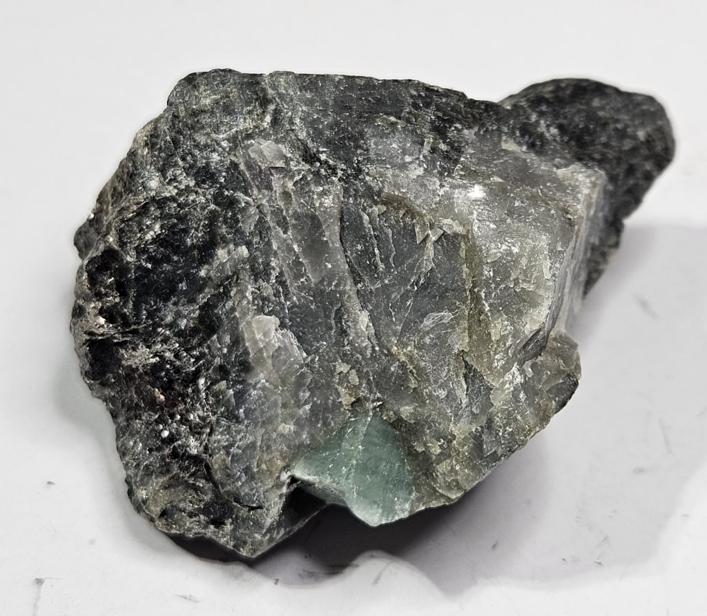 33.43 gram Natural Rough Emerald Specimen: Item is the exact item in the image - Bidder is responsible for all value grade determination - Please review all terms and conditions prior to placing any bids- All sales are final and all invoices d