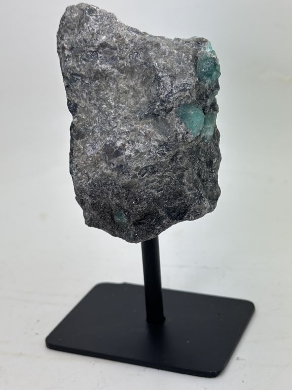 Natural ROugh Emerald Specimen on Stand: Item is the exact item in the image - Bidder is responsible for all value and grade determination. Please review all terms and conditions prior to placing any bids-