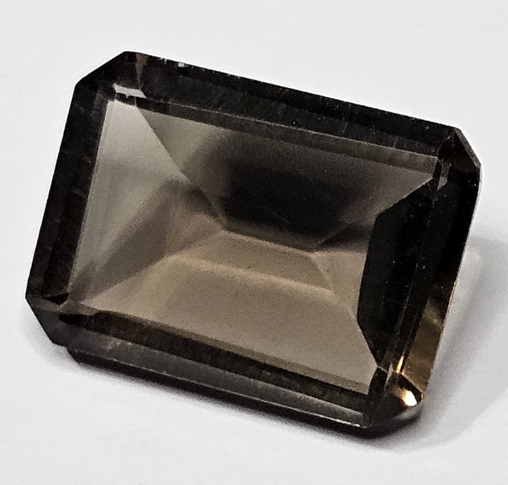 5.75 ct. Natural Rectange Cut Smoky Quartz Gem: Items are as described in the tile - Please use the image to verify the item - Please review the entire terms and conditions prior to placing any bids- All sales final -