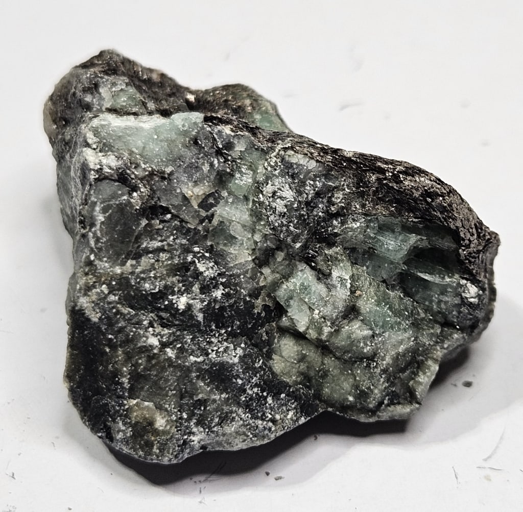 23.84 gram Natural Emerald Rough Specimen: Item is the exact item in the image - Bidder is responsible for all value grade determination - Please review all terms and conditions prior to placing any bids- All sales are final and all invoices d