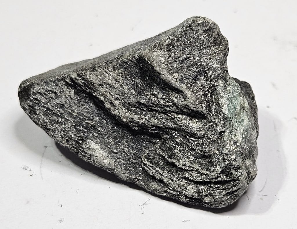 29.75 gram Natural Rough Cut Emerald Specimen: Item is the exact item in the image - Bidder is responsible for all value grade determination - Please review all terms and conditions prior to placing any bids- All sales are final and all invoices d