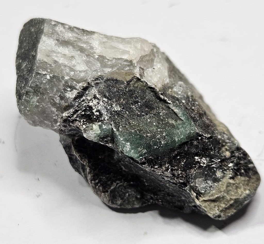22.71 gram Natural Rough Emerald Specimen: Item is the exact item in the image - Bidder is responsible for all value grade determination - Please review all terms and conditions prior to placing any bids- All sales are final and all invoices d