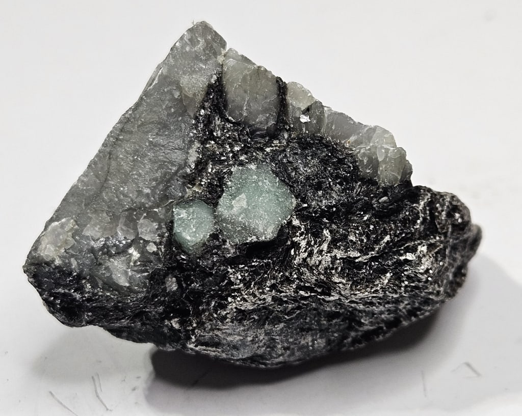 27.68 gram Natural Rough Emerlad Specimen: Item is the exact item in the image - Bidder is responsible for all value grade determination - Please review all terms and conditions prior to placing any bids- All sales are final and all invoices d