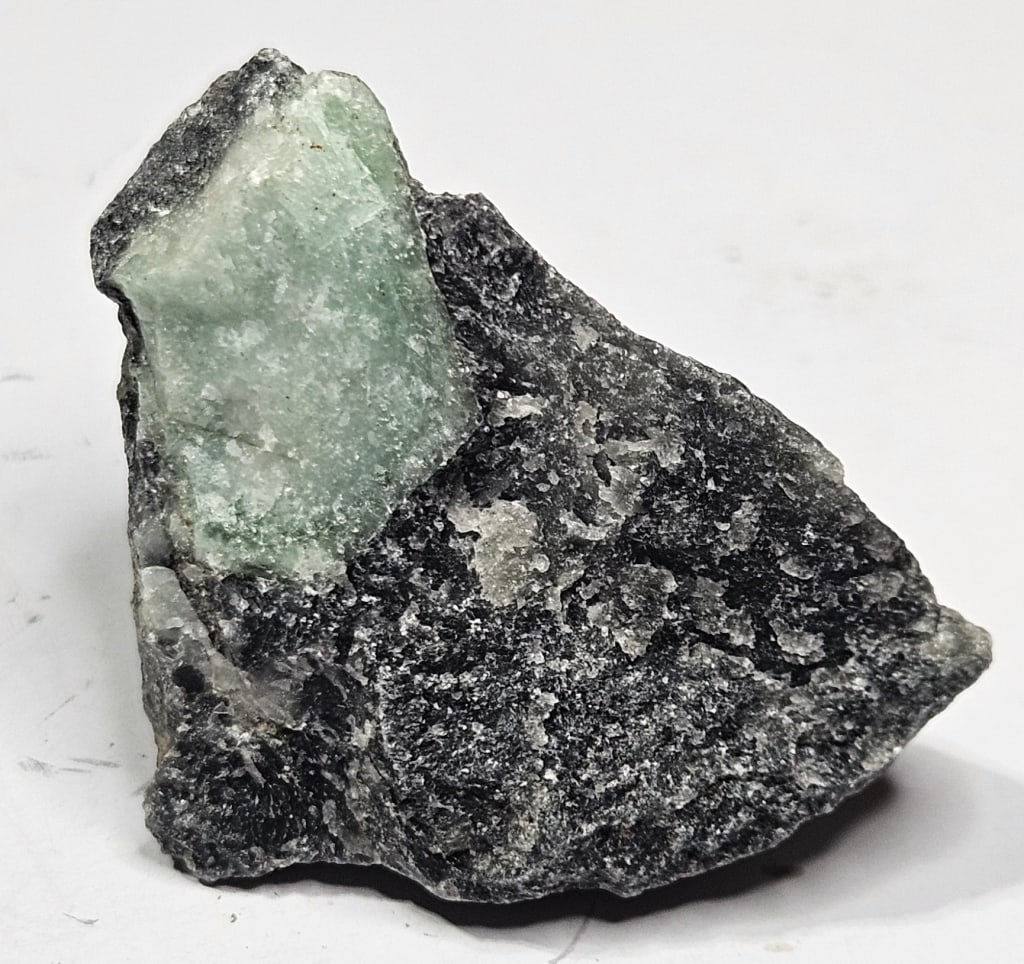 19.55 gram Natural Rough Emerald Specimen: Item is the exact item in the image - Bidder is responsible for all value grade determination - Please review all terms and conditions prior to placing any bids- All sales are final and all invoices d
