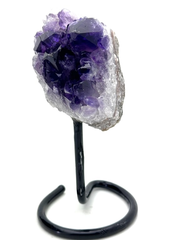 Superior Amethyst Cluster on Stand: Amethyst is a violet variety of quartz. Ancient Greeks wore amethyst and carved drinking vessels from it in the belief that it would prevent intoxication. Amethyst, a semiprecious stone, is often used