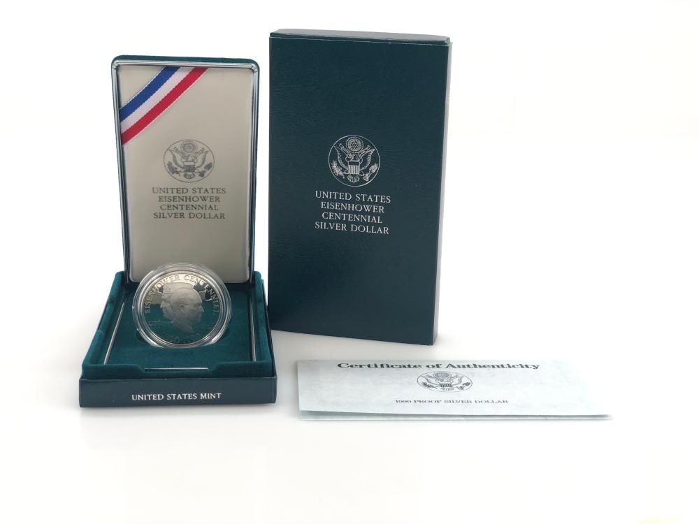 1990 IKE Commemorative Dollar in OMP: Items are as shown in the image and described in the title - Please note that we have more than one of these items and the exact item in the image may not be the item you recieve. Winning bidder will