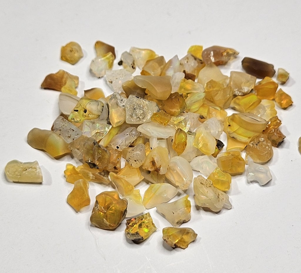 60 tcw. Natural Rough Opal Parcel: Item is the exact item in image - Bidder is responsible for all value and grade determination - Please review all terms prior to placing any bids- Any bid is an agreement to all terms and