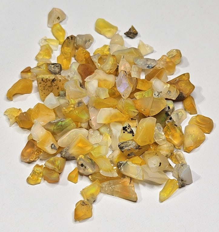 63.70 tcw. Natural Rough Opal Parcel: Item is the exact item in image - Bidder is responsible for all value and grade determination - Please review all terms prior to placing any bids- Any bid is an agreement to all terms and conditions -