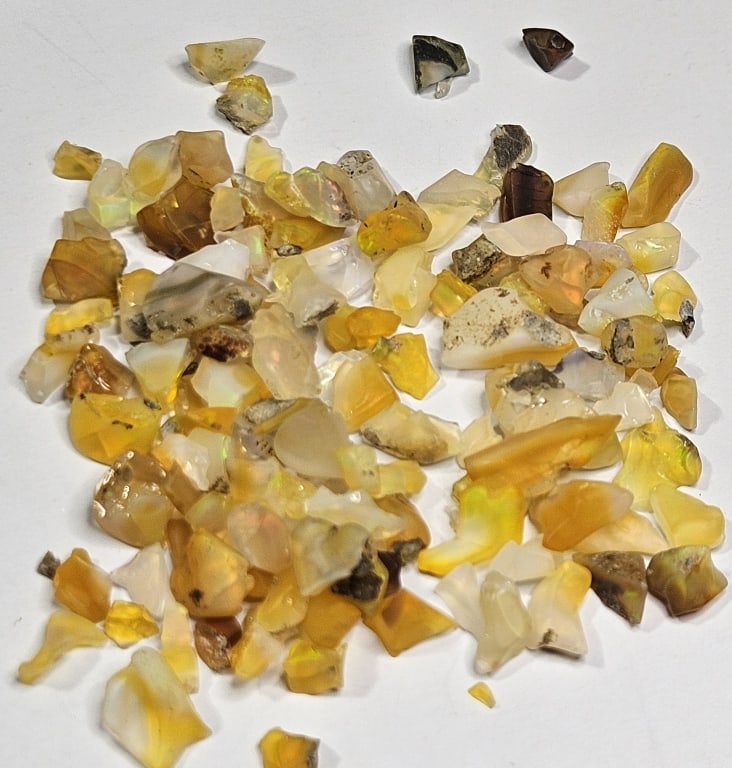 60.75 tcw. Natural Rough Opal Parcel: Item is the exact item in image - Bidder is responsible for all value and grade determination - Please review all terms prior to placing any bids- Any bid is an agreement to all terms and
