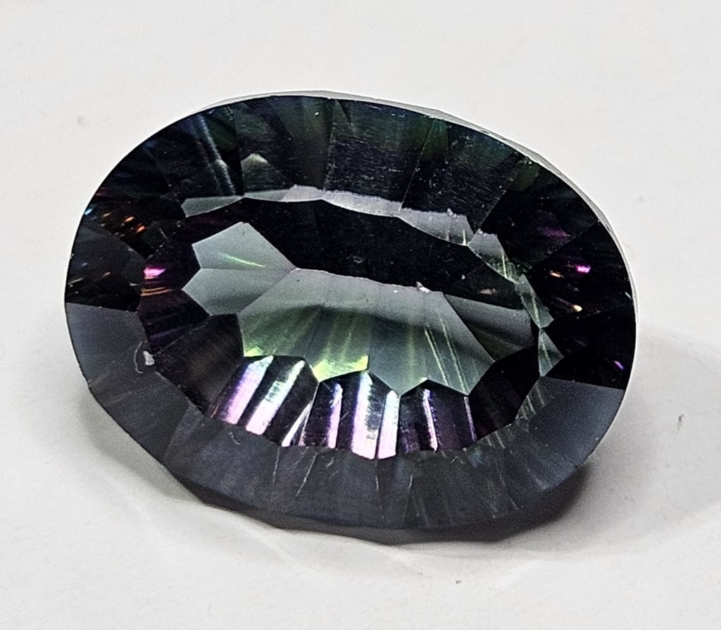 Massive 20 ct. Mystic Topaz Gemstone: Items are as described in the tile - Please use the image to verify the item - Please review the entire terms and conditions prior to placing any bids- All sales final -