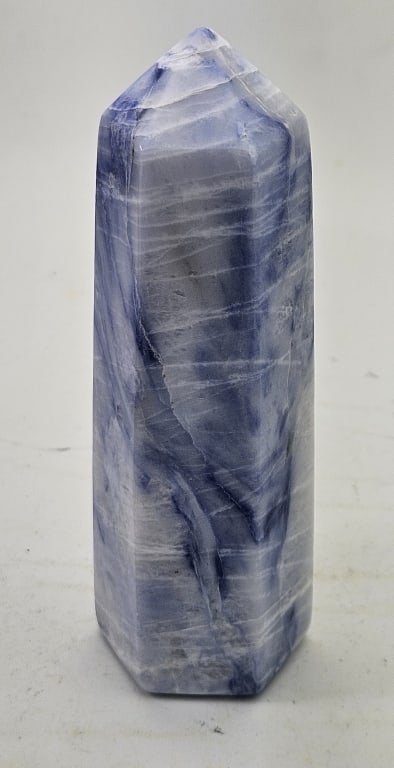 5 Inch Afghanite Polished Point Tower- 6 sided: Item is the exact item in the image - Please review all terms and conditions prior to placing any bids - Bidder is responsible for all value grade dtermination - All sales final and any bid is an agre