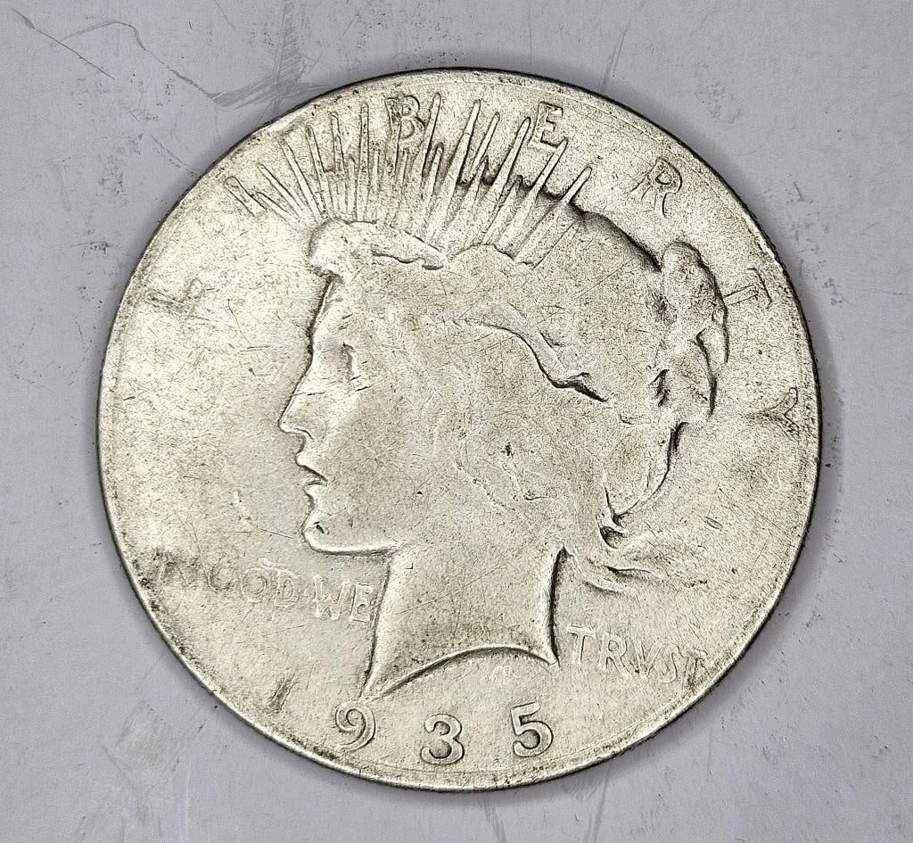 1935 S Better Date Peace Dollar- $75 CPG: Item is the exact item in the image - Bidder is responsible for all value and grade determination - Please review all terms prior to placing any bids - All sales 