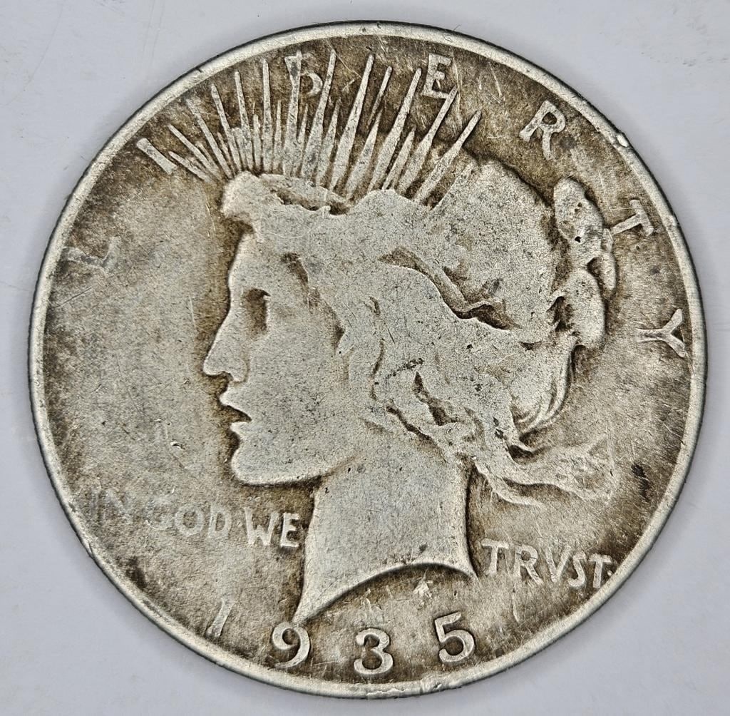 1935 S Better Date Peace Dollar- $85 CPG: Item is the exact item in the image - Bidder is responsible for all value and grade determination - Please review all terms prior to placing any bids - All sales 