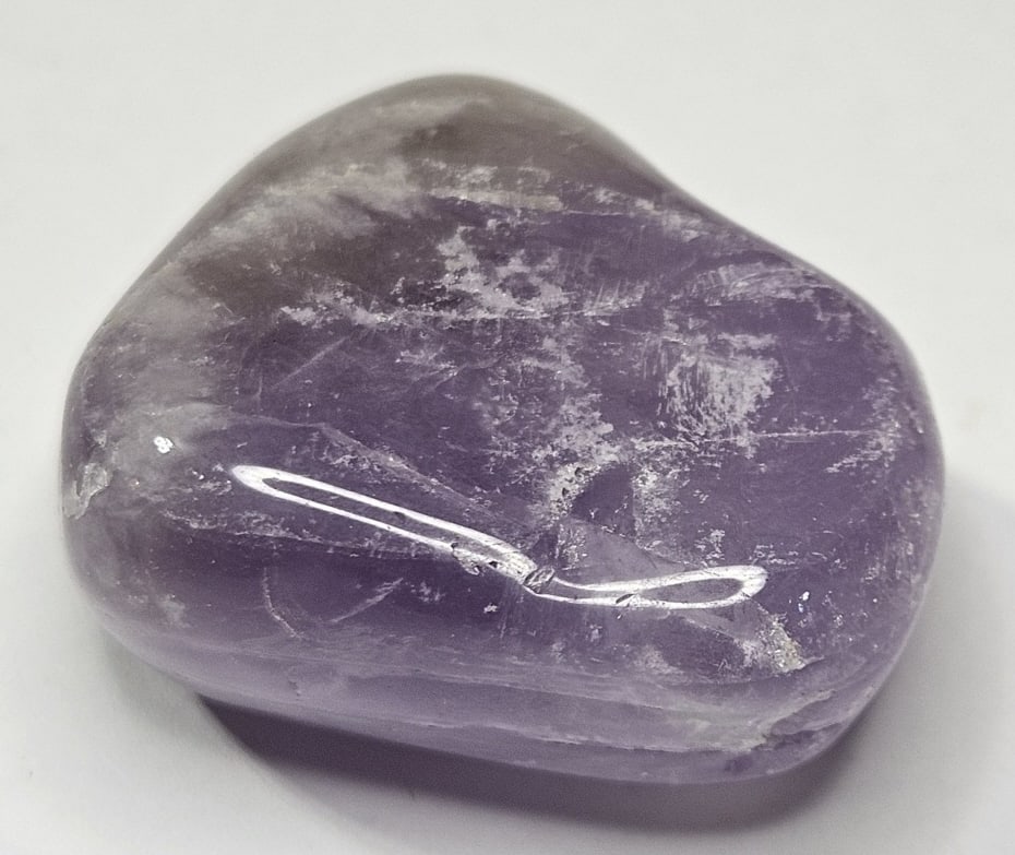 37.94 gram Amethyst Tumbled Stone: Item is the item in the image - Bidder is responsible for all value and grade determination - Please review all terms and conditions prior to placing any bids- All 