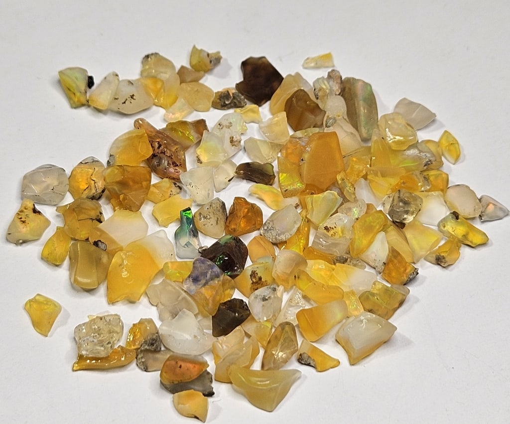61.05 tcw. Natural Rough Opal Parcel: Item is the exact item in image - Bidder is responsible for all value and grade determination - Please review all terms prior to placing any bids- Any bid is an agreement to all terms and conditions -