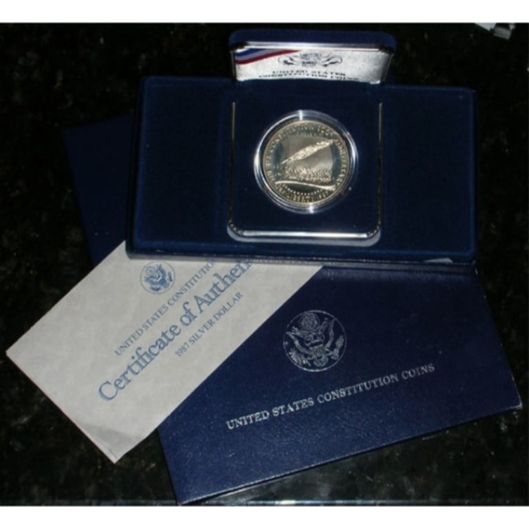 1987 Constitution Proof Dollar in OMB: Item is as shown in the image - Bidder is responsible for all grade and value determination - Please review the entire terms and conditions prior to placing any bids. All terms apply to each