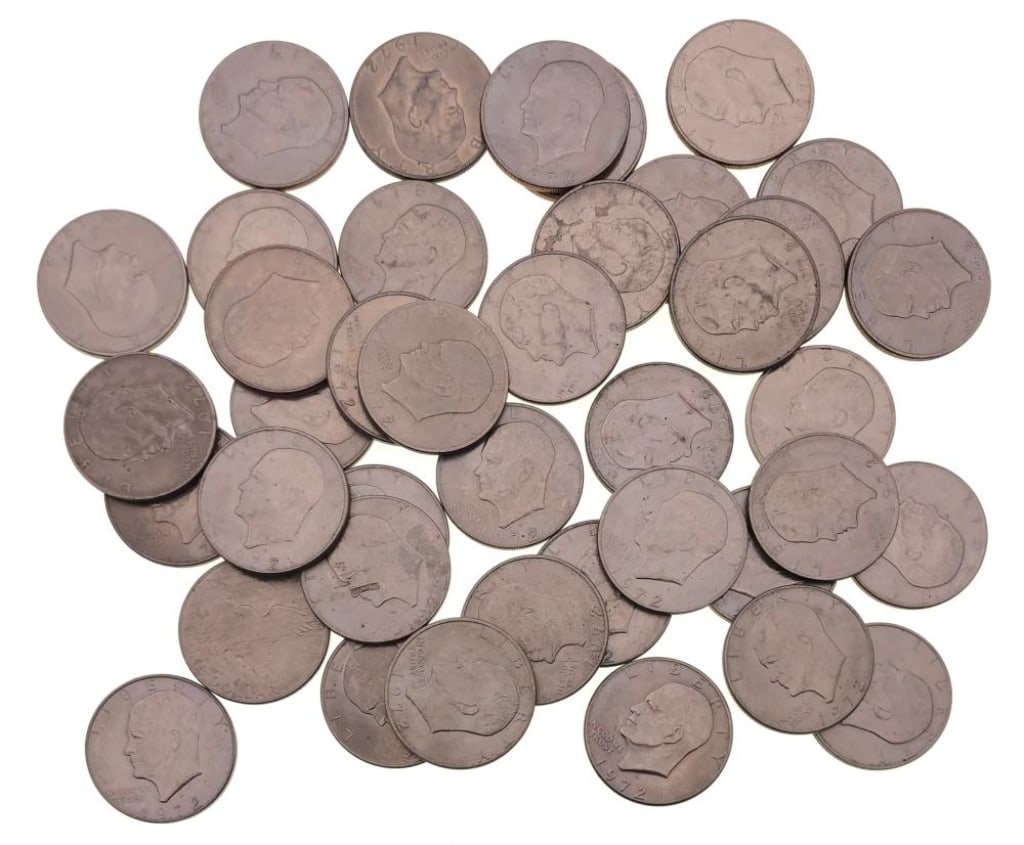 (40) 1971-78 Ike Dollars Various Dates Grades: Items are as shown in the image and described in the title - Please note that we have more than one of these items and the exact item in the image may not be the item you recieve. Winning bidder will