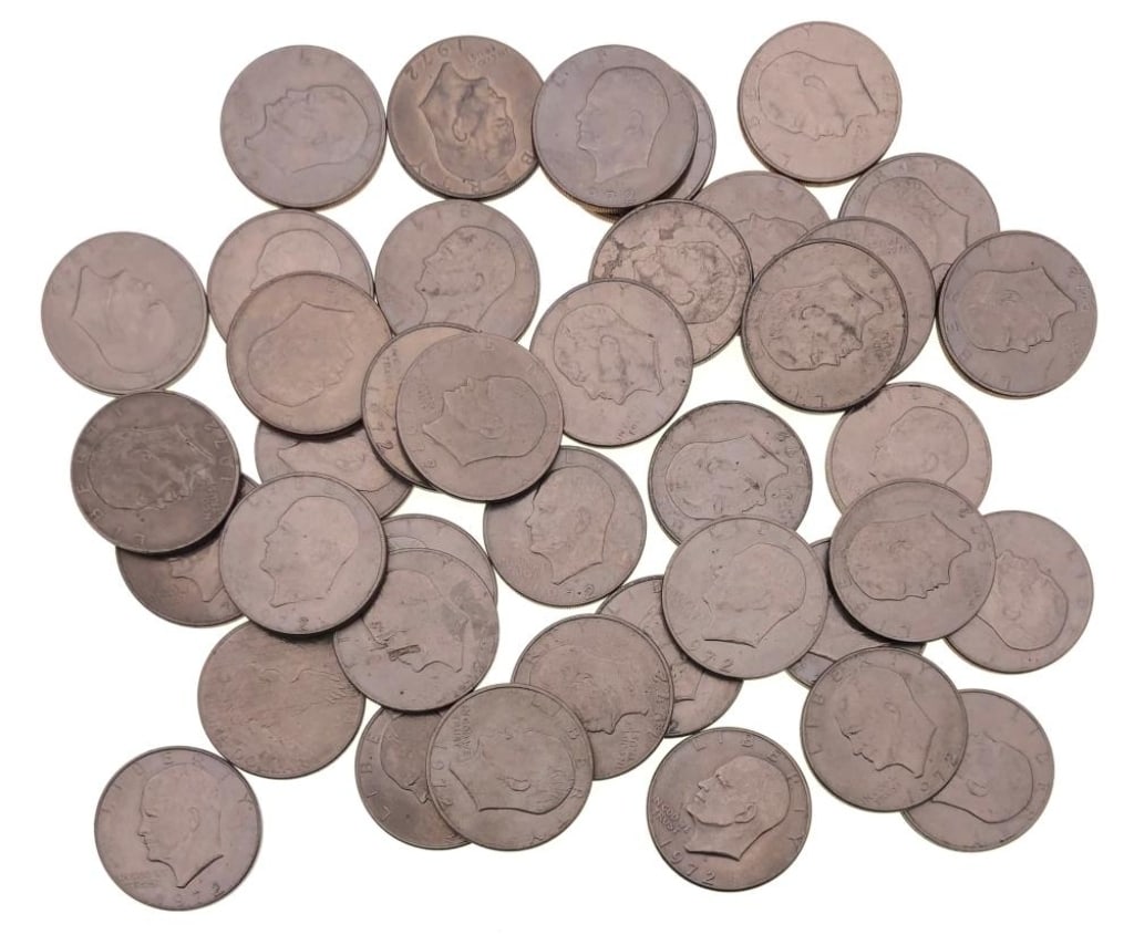 (40) 1971-78 Ike Dollars Various Dates Grades: Items are as shown in the image and described in the title - Please note that we have more than one of these items and the exact item in the image may not be the item you recieve. Winning bidder will