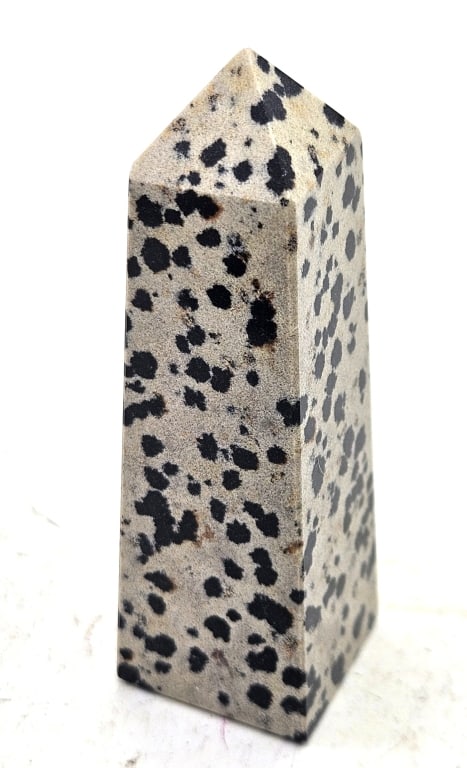 72.3 gram Natural Dalmation Jasper Tower Point: Item is the exact item in the image- Bidder is responsible for all value and grade dtermination - Please review all terms and conditions prior to placing any bids-