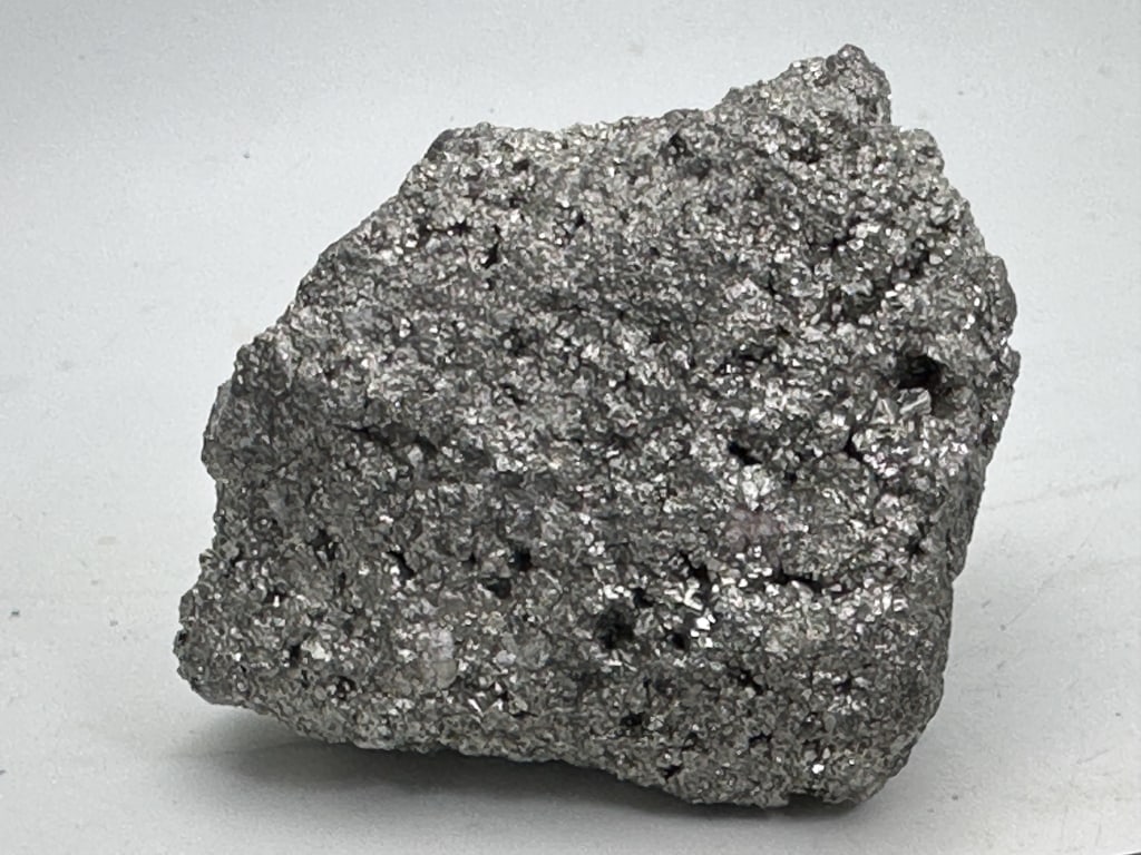 701.81 gram Natural Pyrite Cluster: Pyrite's metallic luster and pale brass-yellow hue give it a superficial resemblance to gold, hence the well-known nickname of fool's gold. The color has also led to the nicknames brass, brazzle,