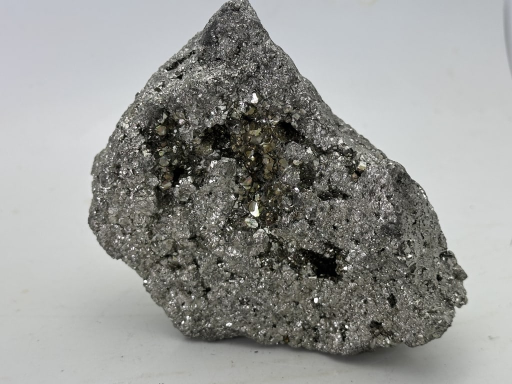 700 gram Natural Pyrite Specimen: Pyrite's metallic luster and pale brass-yellow hue give it a superficial resemblance to gold, hence the well-known nickname of fool's gold. The color has also led to the nicknames brass, brazzle,