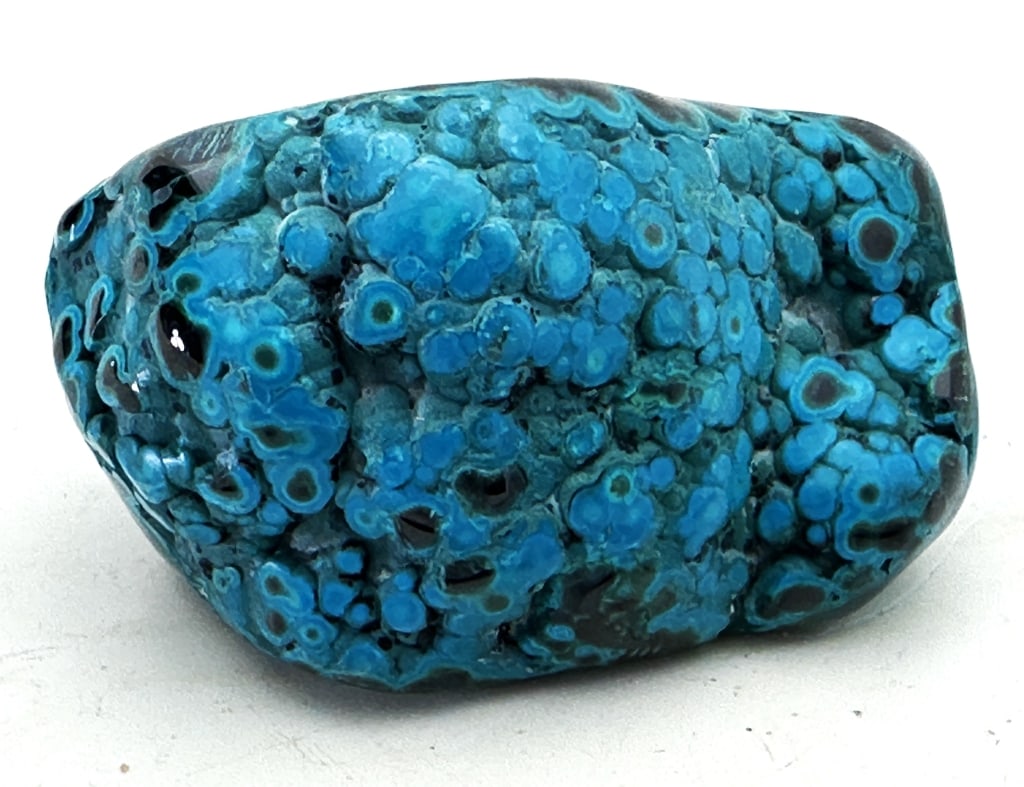 333.78 Botryoidal Chrysocolla/Malachite Specimen: Chrysocolla has a cyan (blue-green) color and is a minor ore of copper, having a hardness of 2.5 to 7.0. It is of secondary origin and forms in the oxidation zones of copper ore bodies. Associated