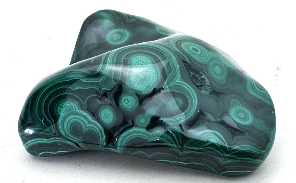 263.98 gram Natural Malachite Specimen: This opaque, green-banded mineral crystallizes in the monoclinic crystal system, and most often forms botryoidal, fibrous, or stalagmitic masses, in fractures and deep, underground spaces, where the