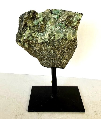 Natural Freeform Rough Cut Emerald on Stand: STAND NOT INCLUDED - Item is the exact item in the image - Bidder is responsible for all value and grade determination - Please review all terms and conditions prior to placing any bids- All sales