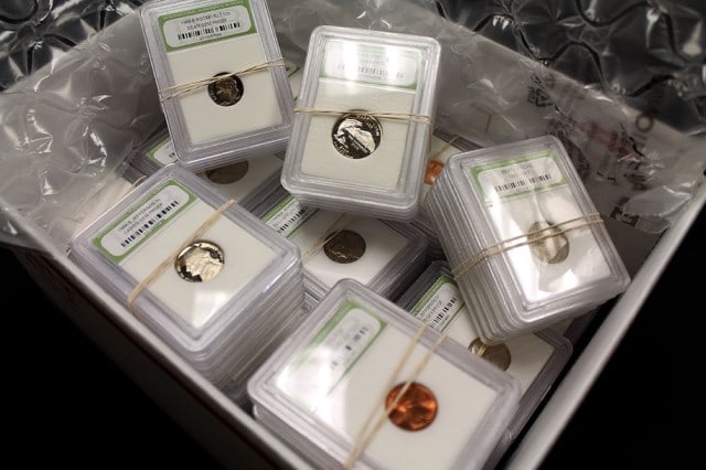 (50) Random Date BU and Proof Coins in Slabs: Item is as shown in the image - Bidder is responsible for all grade and value determination - Please review the entire terms and conditions prior to placing any bids. All terms apply to each