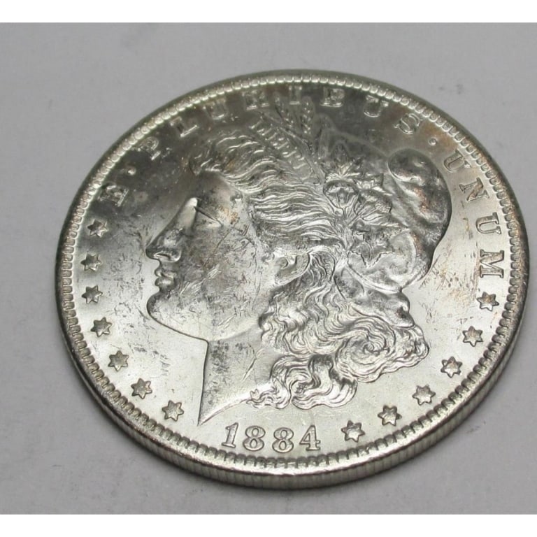 1884 O BU Grade Morgan Silver Dollar: Type will be our choice and from on hand at time of sale. Item is the EXACT ITEM in the image. Bidder is responsible for all value and determination of value. The images are high