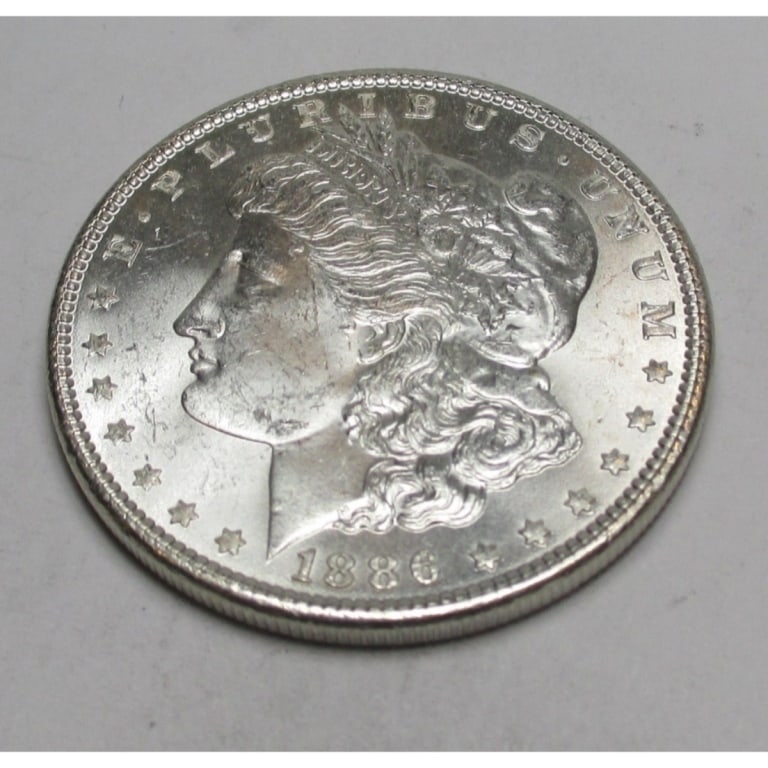 1886 P BU Grade Morgan Silver Dollar: Type will be our choice and from on hand at time of sale. Item is the EXACT ITEM in the image. Bidder is responsible for all value and determination of value. The images are high resolution
