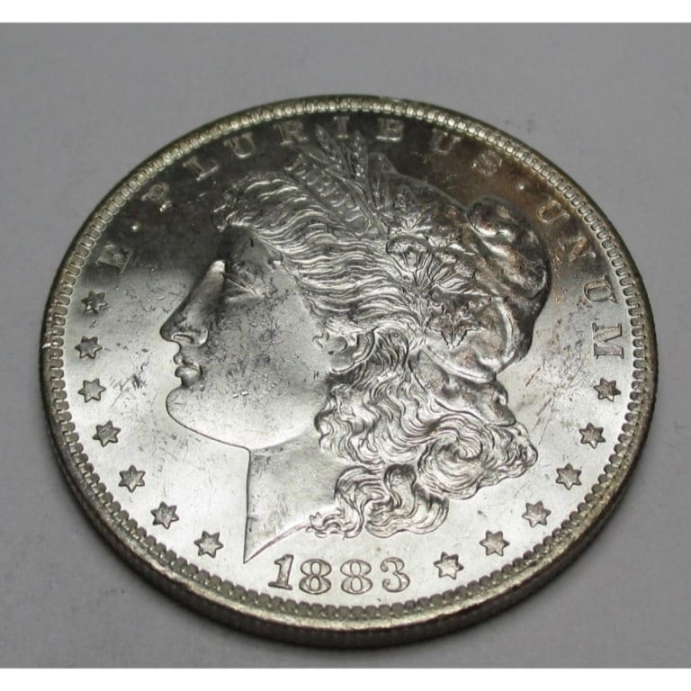 1883 O BU Grade Morgan Silver dollar: Type will be our choice and from on hand at time of sale. Item is the EXACT ITEM in the image. Bidder is responsible for all value and determination of value. The images are high resolution