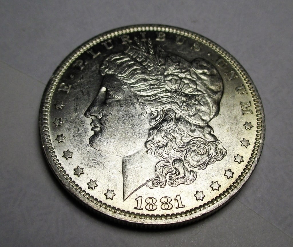 1881 O Morgan Silver Dollar: Items are as shown in image. Bidder is responsible for all grade and value. Please review all terms and understand shipping procedure prior to bidding.