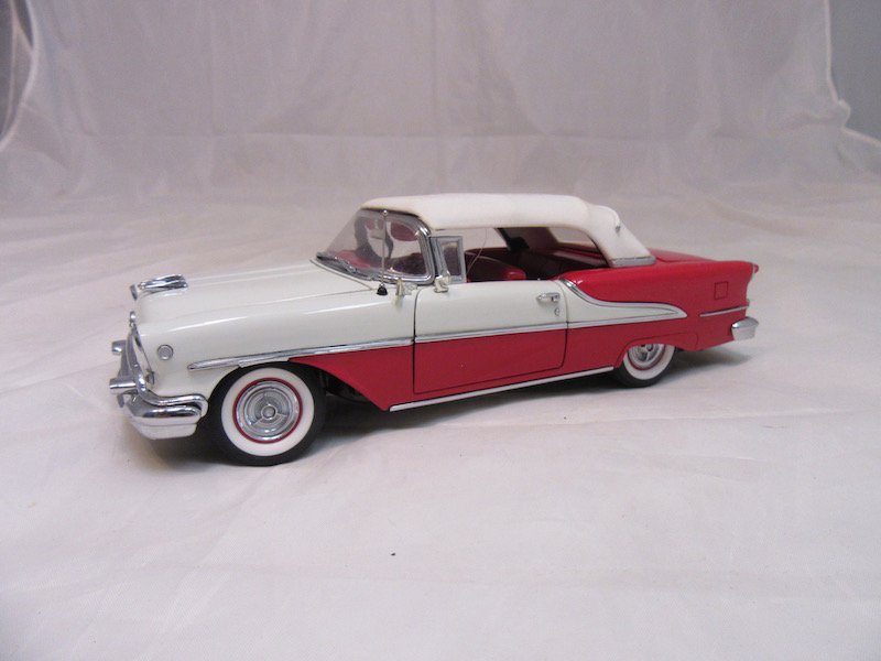 Danbury Mint 1955 Oldsmobile Super Eighty-Eight: Good condition. One small piece is broken off. Includes the box, inserts, certificate of authenticity, and more.