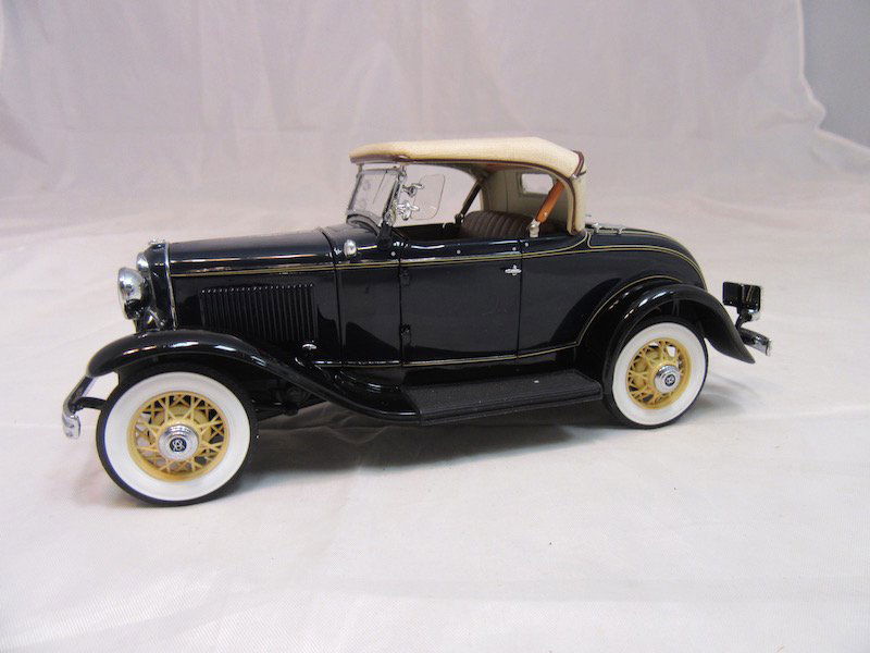 Danbury Mint 1932 Ford De Luxe Roadster V-8: Great condition, includes the box, inserts, certificate of authenticity, and more.