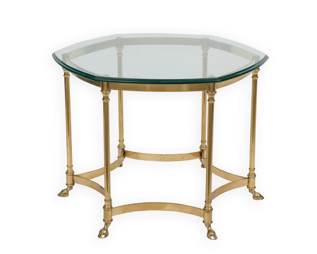 Brass and Glass Claw Foot Table: Description - A brass and glass claw foot table. Dimensions - 22" x 29"