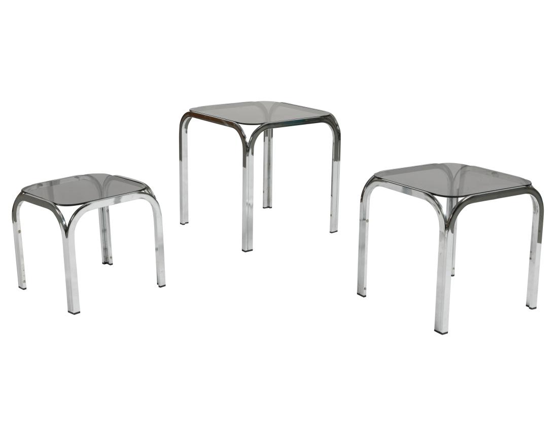 Chrome and Black Glass Nesting Tables: Description - A set of chrome and black glass nesting tables. Dimensions - Largest - 17" x 16"