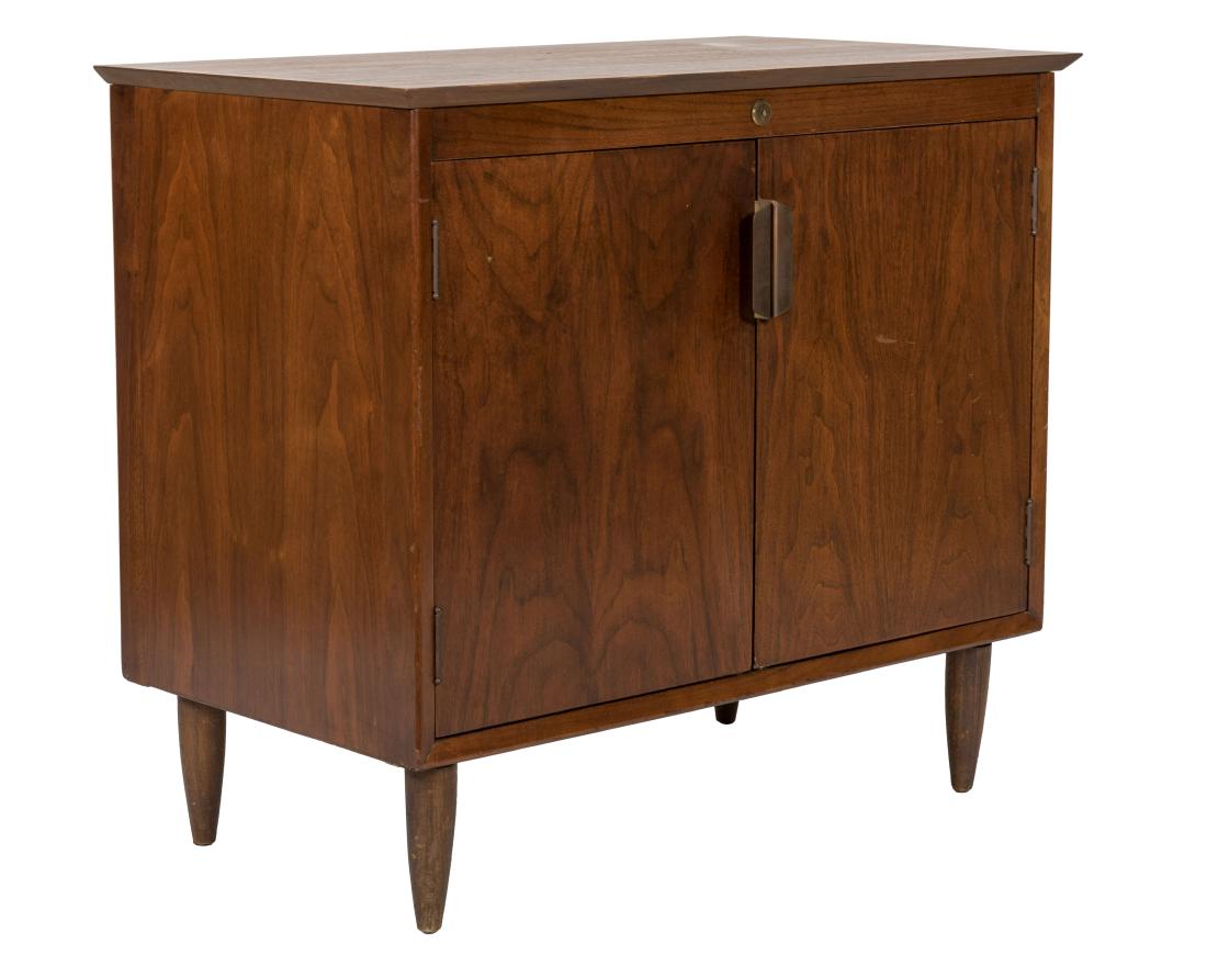 Mid Century Cabinet: Description - A mid century cabinet with brass pulls. Dimensions - 28" x 31" x 18"